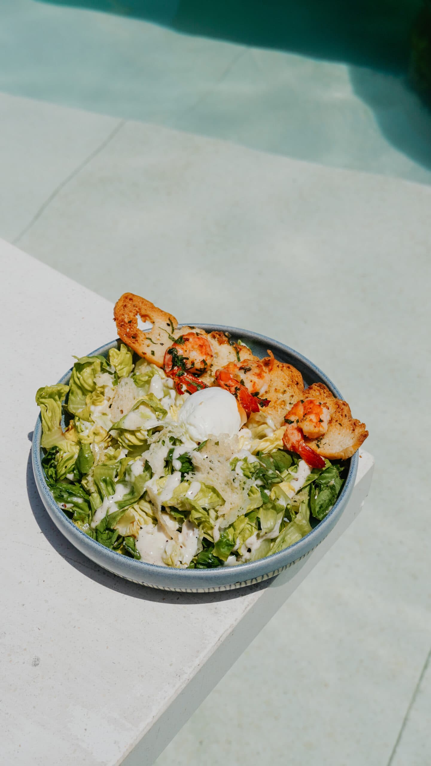 Revamp Your Salad Game with Garlicky Caesar Salad Topped with Garlic Butter Prawn and Parmesan Tuile